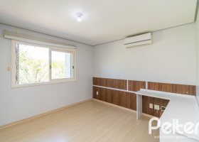 Casa em Condomínio à venda com 217m², 3 dormitórios, 1 suíte, 2 vagas, no bairro Terra Ville em Porto Alegre