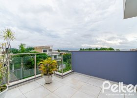 Casa à venda com 120m², 3 dormitórios, 1 suíte, 1 vaga, no bairro Guarujá em Porto Alegre